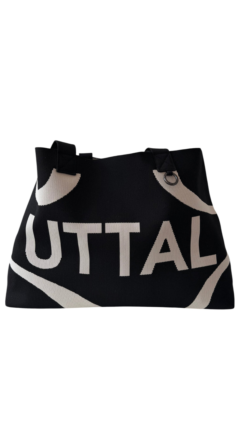 Black UTTAL jacquard knit tote bag with structured silhouette, premium woven fabric and spacious everyday design on a white background