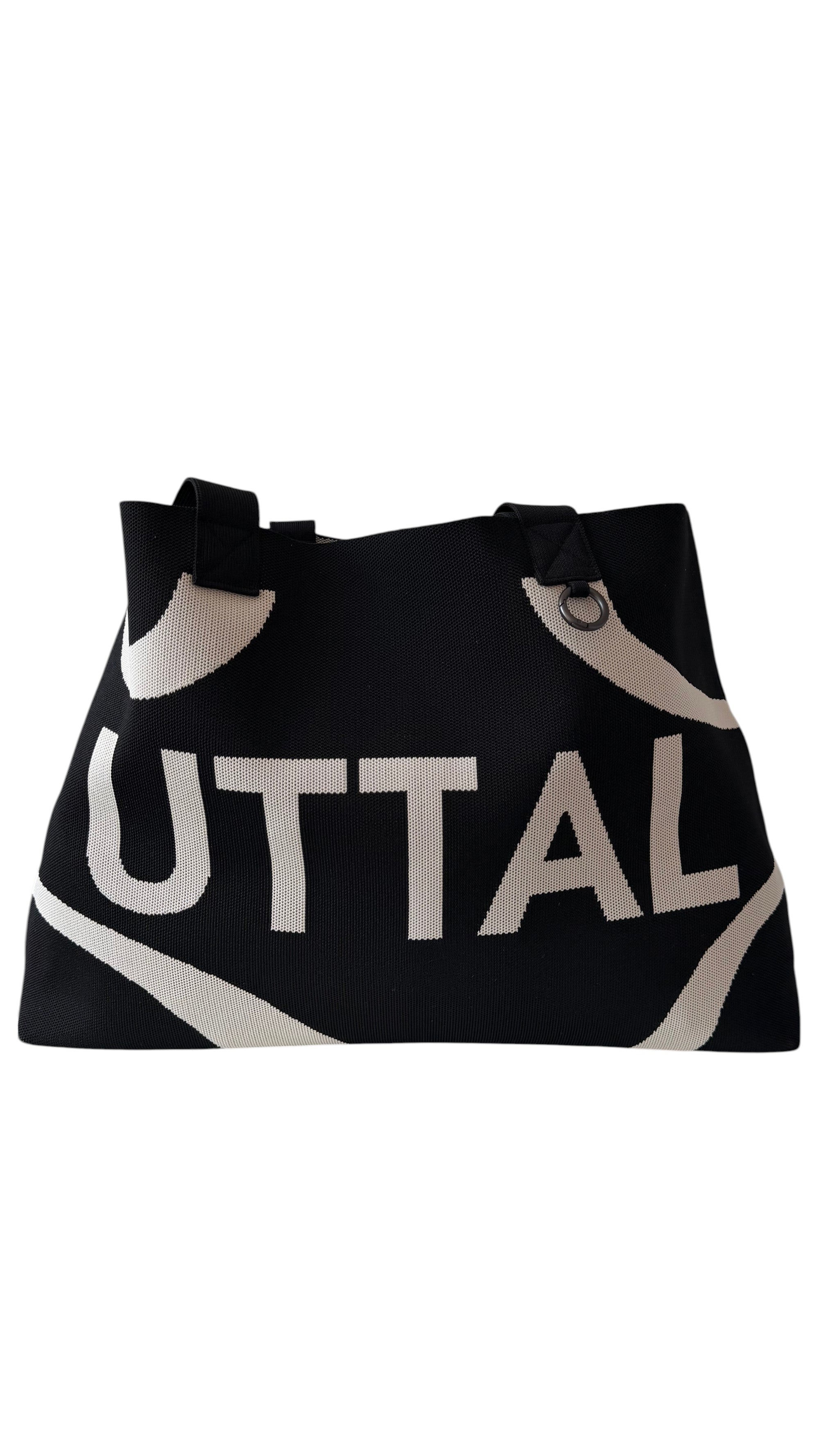 Black UTTAL jacquard knit tote bag with structured silhouette, premium woven fabric and spacious everyday design on a white background
