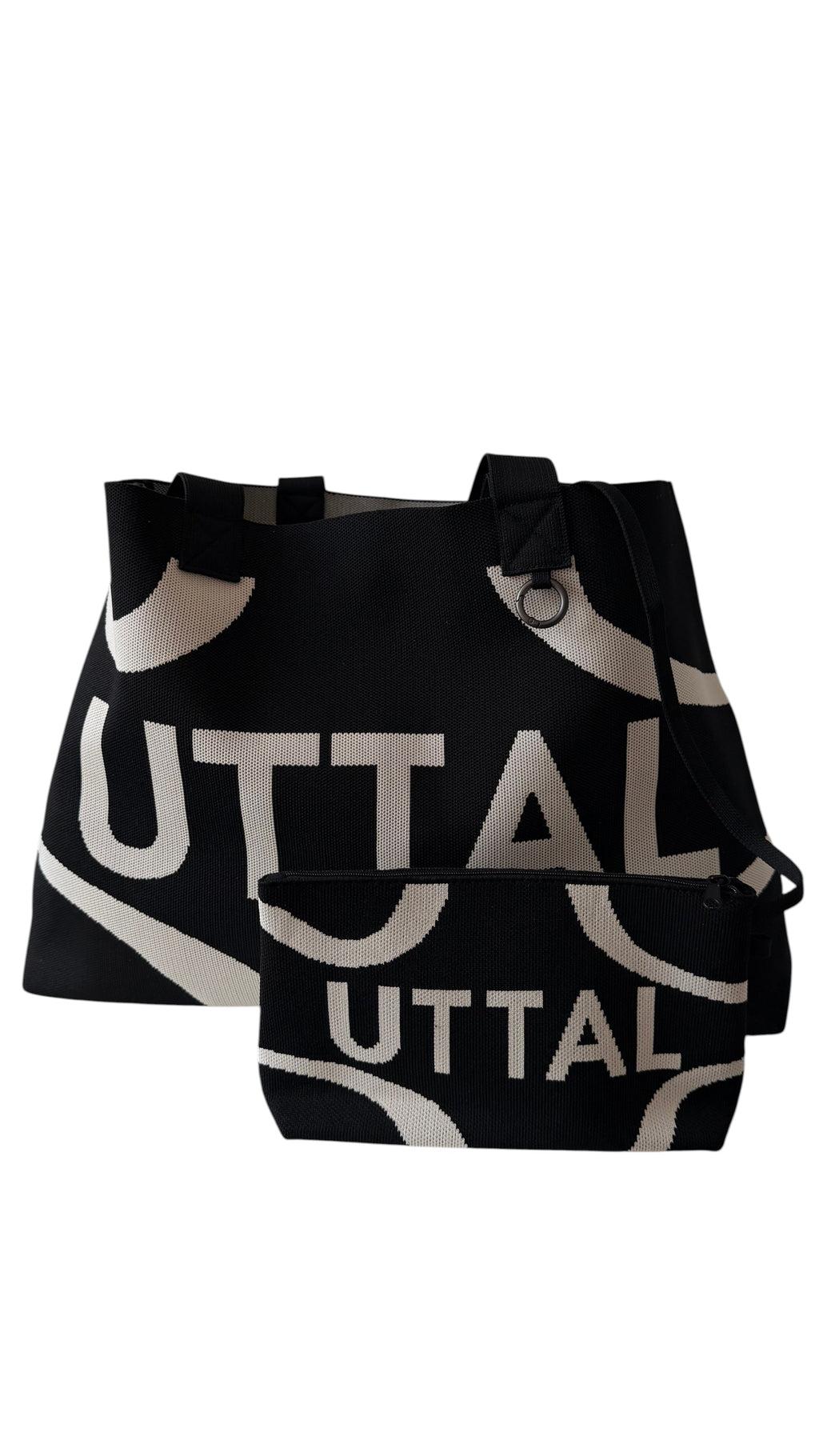 Black UTTAL jacquard knit tote bag with matching pouch, structured silhouette and premium woven fabric