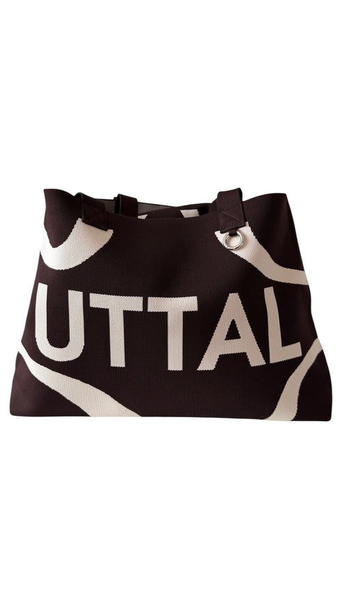 Chocolate Brown UTTAL jacquard knit tote bag with structured silhouette, premium woven fabric and spacious interior on a white background