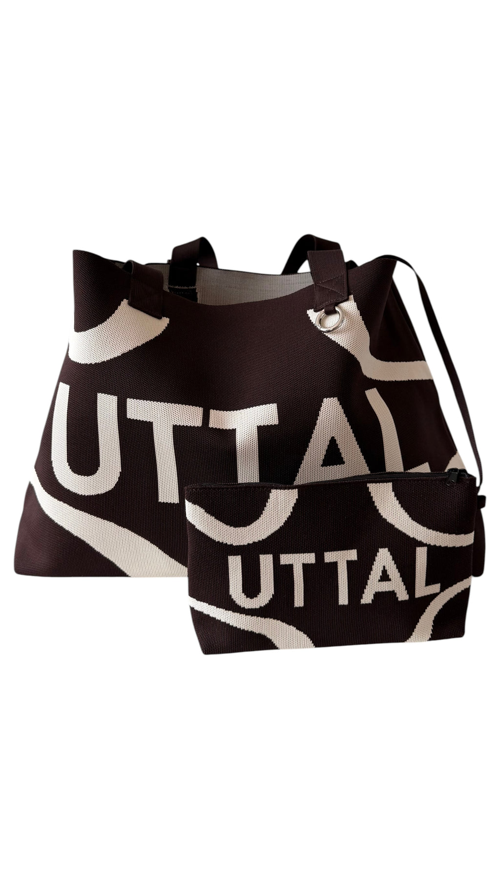 Chocolate Brown UTTAL jacquard knit tote bag with matching pouch, structured design, adjustable shoulder strap and premium woven pattern on a white background"